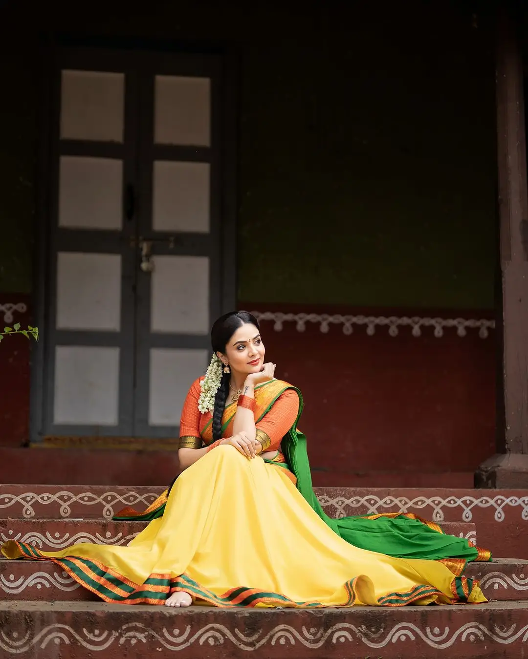 Sreemukhi Stills in Yellow Lehenga Orange Choli Green Voni